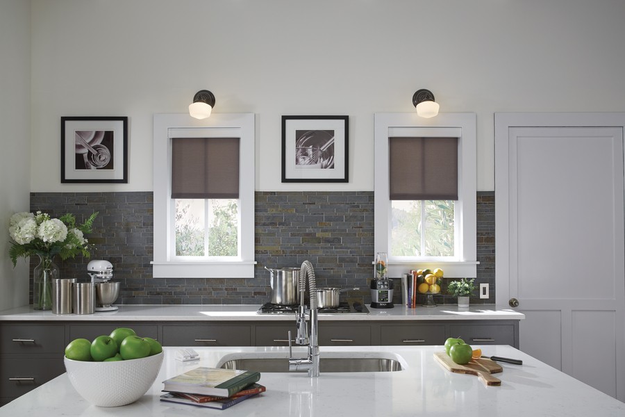 Lutron Sivoia QS motorized shades installed in a kitchen window