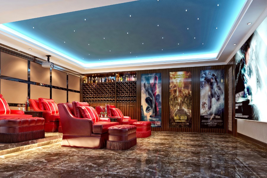 Elegant home theater with red leather seating.